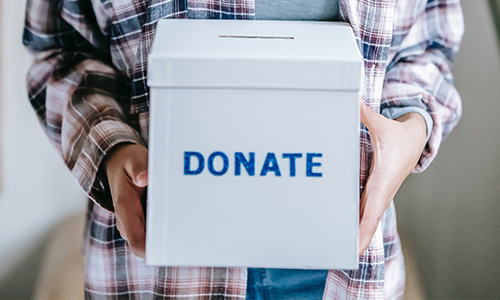 woman holding donate box